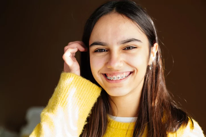 smiling girl with braces